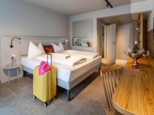 Letto o letti in una camera di ibis Styles Graz Messe