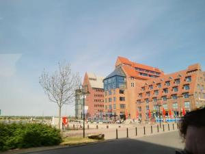 a group of buildings on a city street at Ferienwohnung CityFlair _ 32290 in Rostock