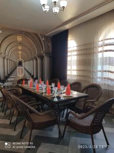 a long table with red napkins on top of it at STATUS in Shymkent