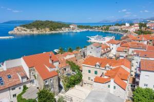 an aerial view of a town with orange roofs at Palace Heritage Apartments in Makarska