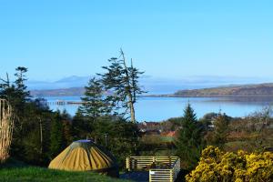 a tent and a view of a lake at Kelburn Yurts in Fairlie
