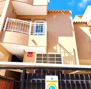 a building with a sign in front of it at ELEGANT 3 BEDROOMS, Wifi free in Adeje