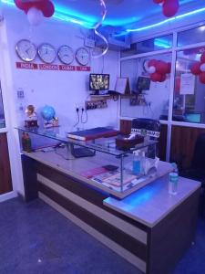 a counter in a room with blue lights at OYO Singh Homestay in New Delhi