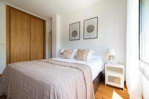 Ένα ή περισσότερα κρεβάτια σε δωμάτιο στο Apartamento Playa Bueu