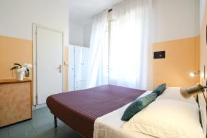 Postel nebo postele na pokoji v ubytování Hotel Montebello Riccione