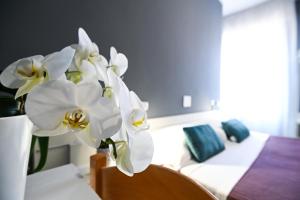 Postel nebo postele na pokoji v ubytování Hotel Montebello Riccione