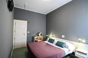 Postel nebo postele na pokoji v ubytování Hotel Montebello Riccione