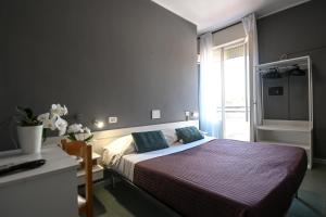 Postel nebo postele na pokoji v ubytování Hotel Montebello Riccione