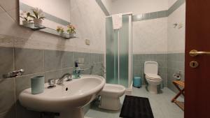a bathroom with a sink and a toilet at Appartamenti in Villa Polimnia in Fontane Bianche +40 photos