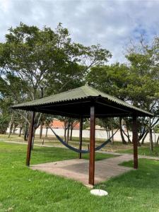 a pavilion with a hammock in a park at Ap Remanso in Barreirinhas
