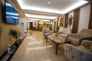 a lobby with a waiting room with chairs and a table at Vera Life Hotel in Istanbul