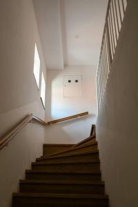 a stair case in a building with stairs and a window at Stairway to Ljubljana Apartment in Ljubljana