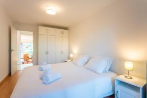 Postel nebo postele na pokoji v ubytování Apartment Aroeira Golf III