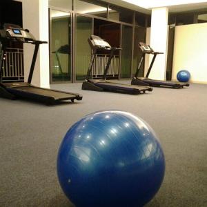 a gym with a large blue ball on the floor at Cozy Homestay Cyber City 3BR Near KKIA 10 minutes KK Centre wifi 30mps astro channel in Kapayan