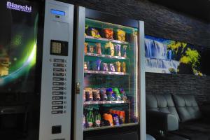 a vending machine filled with lots of drinks at Konak kod Hame in Bihać