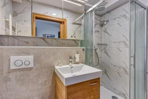 a bathroom with a sink and a shower at Relax House Nizka Savinja - Happy Rentals in Rečica ob Savinji +38 photos