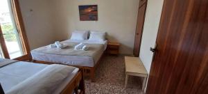 Postel nebo postele na pokoji v ubytování Villa Froso