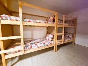 a room with three bunk beds in a room at Unique City Hostel 100 meters from Beach in Larnaca