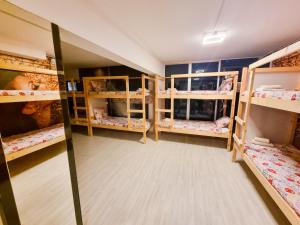 a room with multiple bunk beds in it at Unique City Hostel 100 meters from Beach in Larnaca