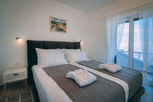 Postel nebo postele na pokoji v ubytování LUMIN 4