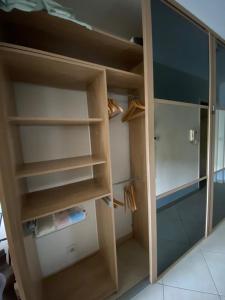 een kast met houten planken in een kamer bij Studio cocooning - Terrasse - Jardin - Piscine in Menton