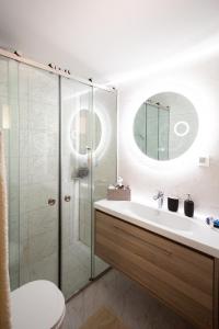 a bathroom with a shower and a sink and a toilet at Zante Sunny Mountain in Anafonítria +35 photos