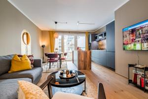a living room with a couch and a table at Eddie’s Design Apartments in Vienna
