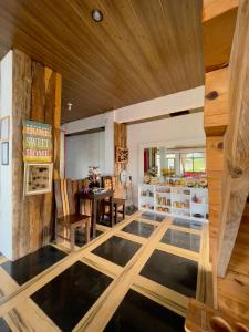 a room with a glass floor and a dining room at Andrew & Mary's Lodging House in Sagada