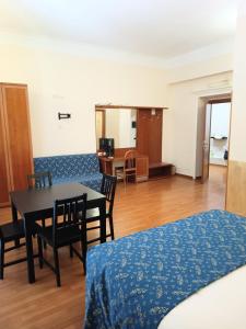 a room with a table and chairs and a dining room at Opera Italian Suite in Rome