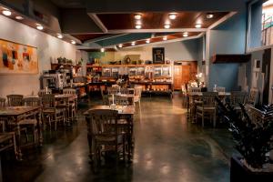 a restaurant with tables and chairs in a room at K MODERN HOTEL in Peschiera del Garda