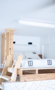 a bedroom with a bed and two chairs at Kellys house in Epanomi