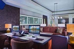 a living room with two computer monitors on a desk at Grand Hyatt Tampa Bay in Tampa