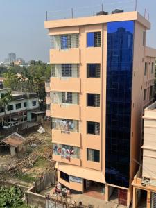 a building with balconies on the side of it at Shibgonj Bed and Breakfast in Sylhet