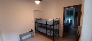 a room with two bunk beds and a table at Hotel Villa Argentina in Riomaggiore