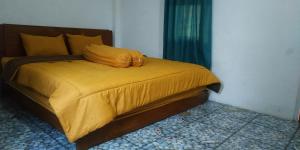 Postel nebo postele na pokoji v ubytování Lobster Homestay