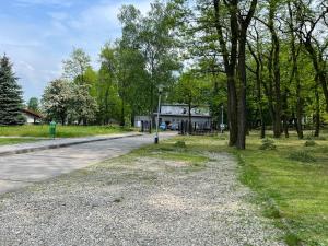 a road in front of a house with trees at Mieszkaj U Marty in Jaworzno
