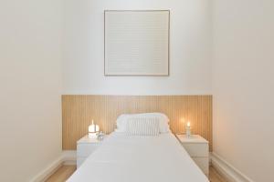 Posteľ alebo postele v izbe v ubytovaní Suites4days Gaudi Eixample