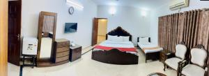 Lova arba lovos apgyvendinimo įstaigoje Capri Residency