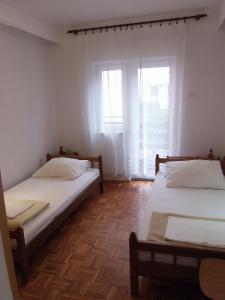 Postel nebo postele na pokoji v ubytování Apartments 031
