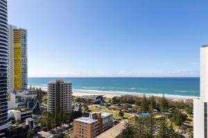 a view of the beach from the balcony of a building at ULTIQA Signature at Broadbeach in Gold Coast