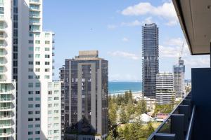 a view of the ocean from a balcony of a building at ULTIQA Signature at Broadbeach in Gold Coast