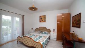 Ένα ή περισσότερα κρεβάτια σε δωμάτιο στο Apartments Petranovic