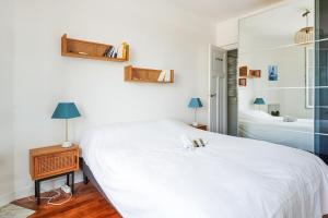 Ένα ή περισσότερα κρεβάτια σε δωμάτιο στο Appartement Lottin - Welkeys