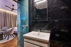 a bathroom with a sink and a mirror at Amuse Luxury Apartments in Zakynthos