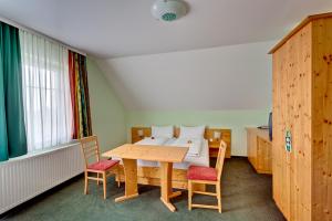 Ein Bett oder Betten in einem Zimmer der Unterkunft Pension Sonnengarten & Therme included - auch am An- & Abreisetag!