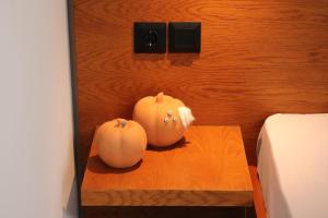 two pumpkins sitting on a table in a bedroom at Elia Studio in Platamonas