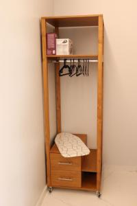 a wooden shelving unit with a cushion on a shelf at Elia Studio in Platamonas