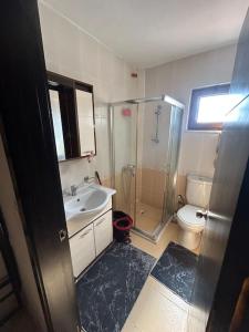 a bathroom with a shower sink and a toilet at 2 minute walk to seaside in Kuşadası