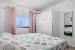 Postel nebo postele na pokoji v ubytování Apartments Vilma