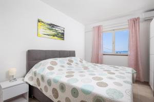 Postel nebo postele na pokoji v ubytování Apartments Vilma
